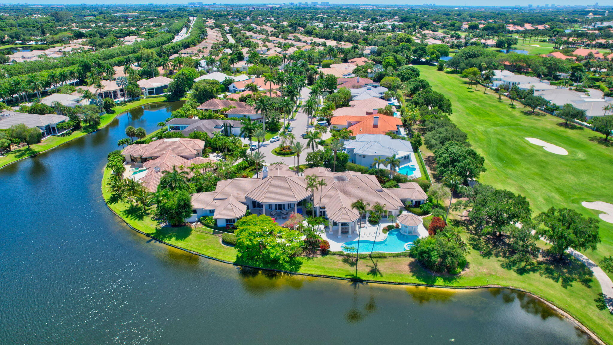 2599 Northwest 63rd Lane Boca Raton, FL 33496 - Photo 3 of 81 an aerial view of a house with a garden and lake view