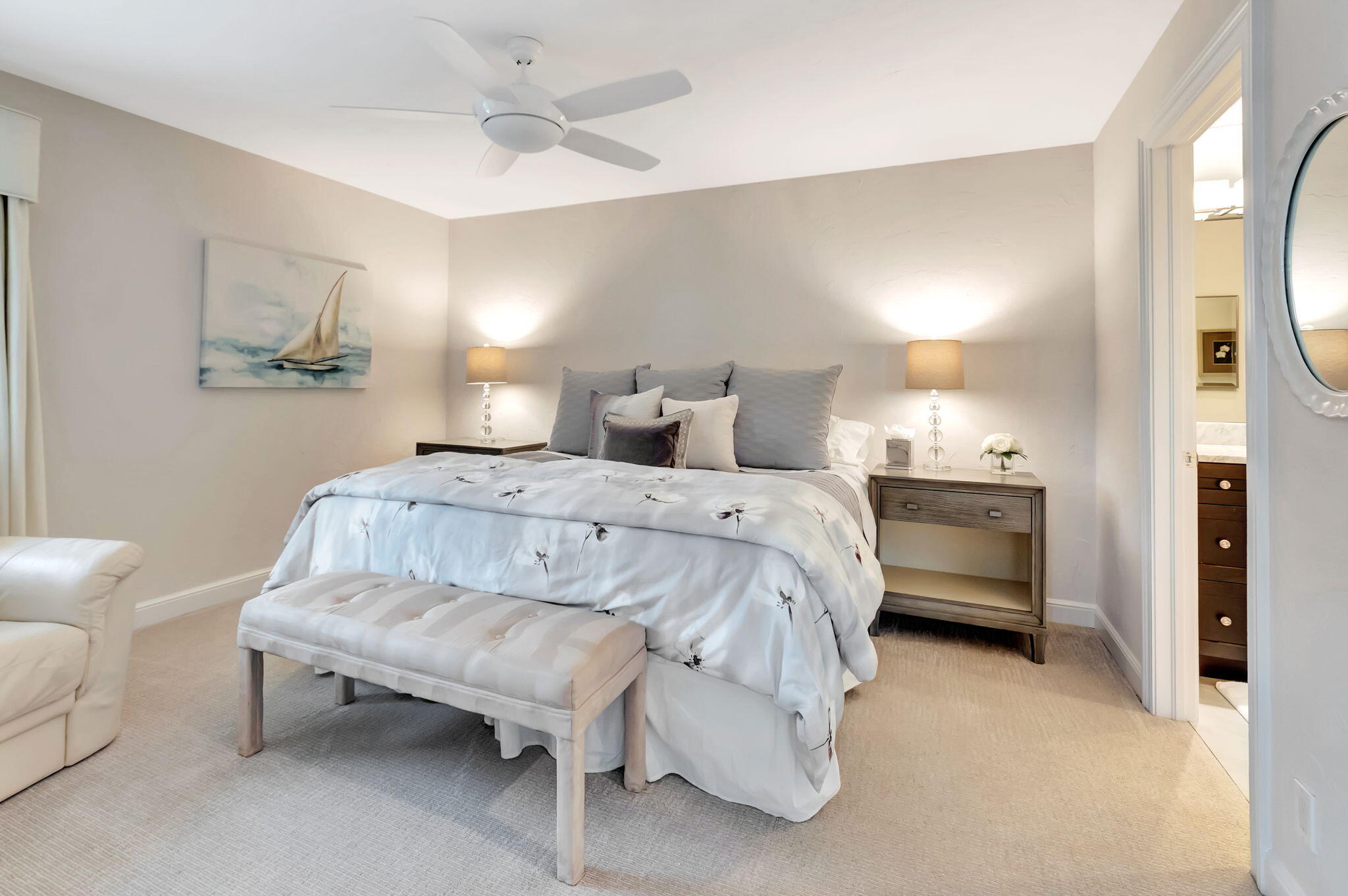 2599 Northwest 63rd Lane Boca Raton, FL 33496 - Photo 35 of 81 a spacious bedroom with a bed and a chandelier