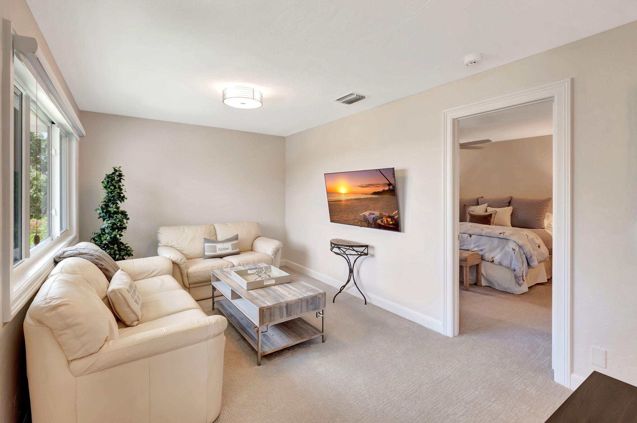 2599 Northwest 63rd Lane Boca Raton, FL 33496 - Photo 38 of 81 a living room with furniture and a flat screen tv