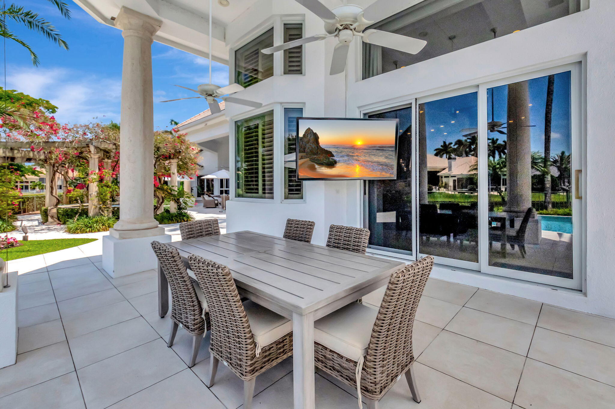 2599 Northwest 63rd Lane Boca Raton, FL 33496 - Photo 41 of 81 a view of a patio with a table and chairs