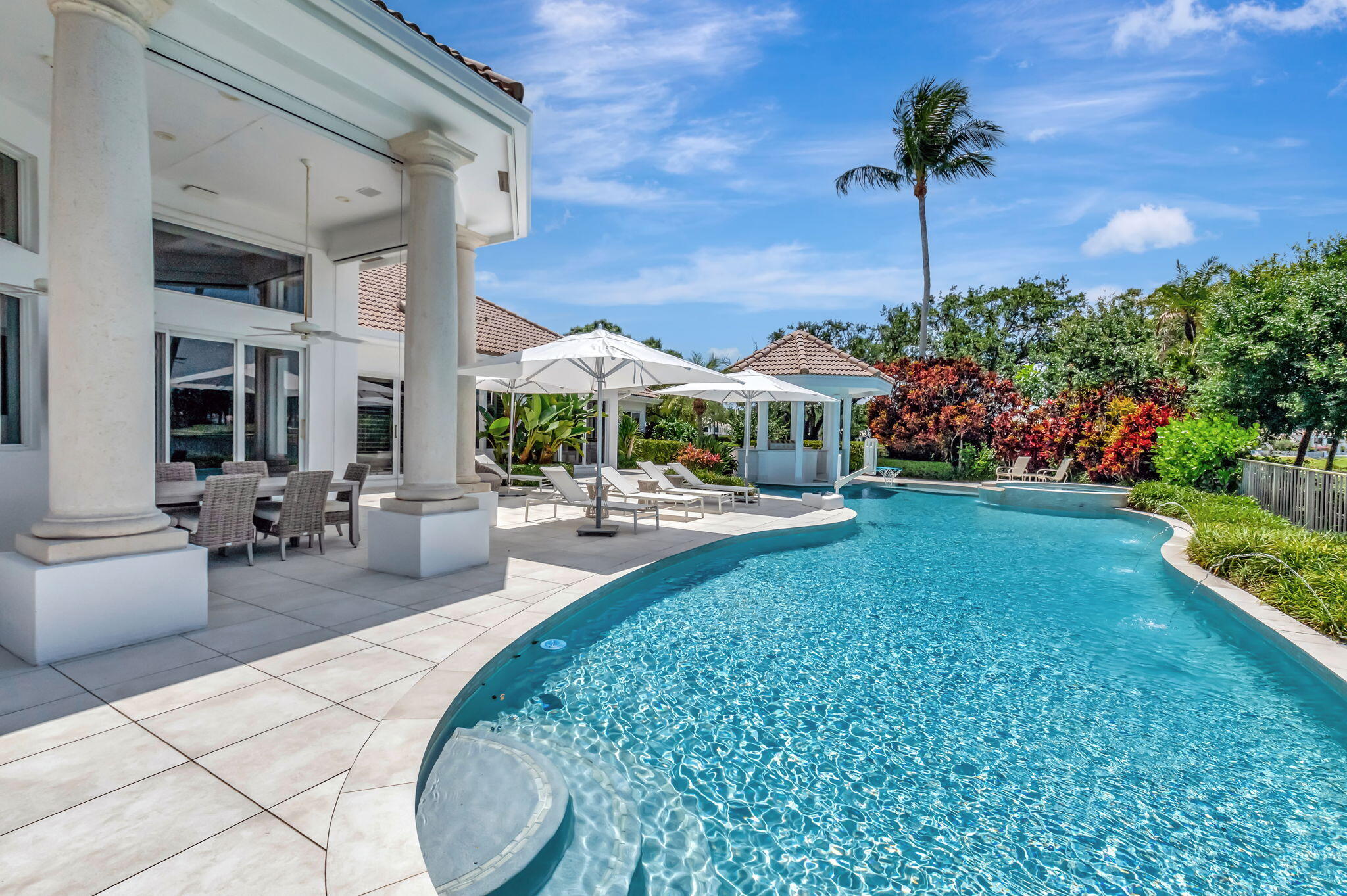 2599 Northwest 63rd Lane Boca Raton, FL 33496 - Photo 44 of 81 a view of a patio with a table and chairs
