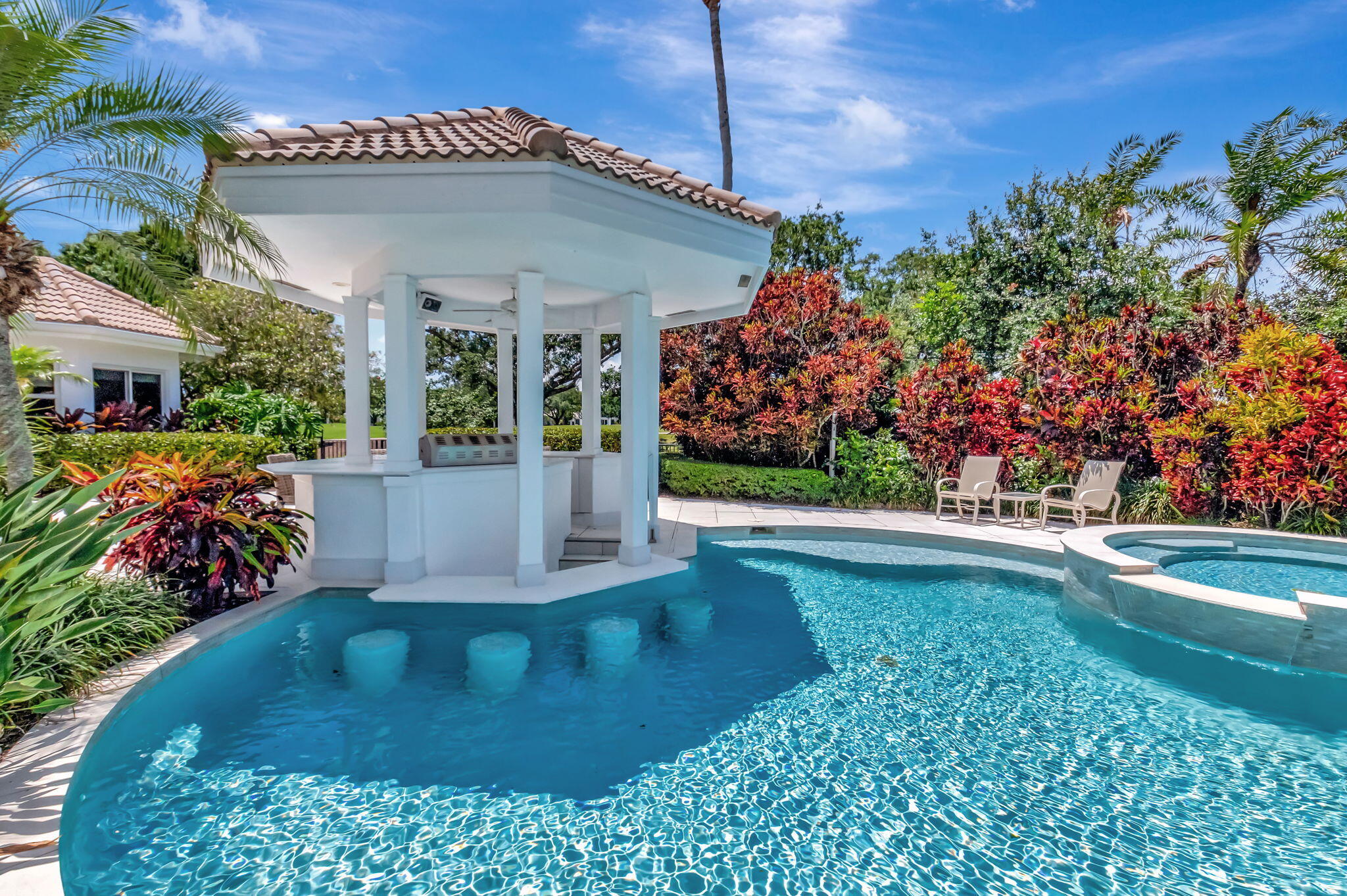 2599 Northwest 63rd Lane Boca Raton, FL 33496 - Photo 48 of 81 a view of a house with a yard and potted plants
