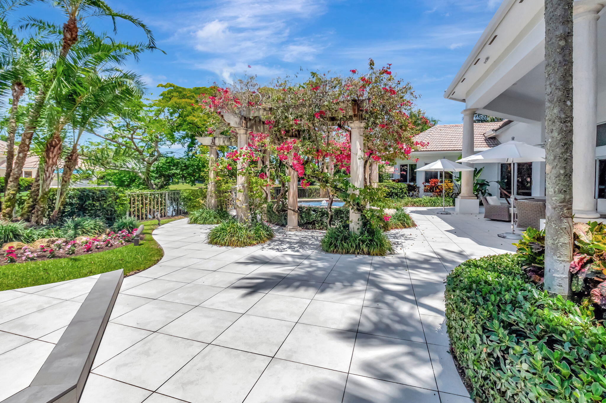2599 Northwest 63rd Lane Boca Raton, FL 33496 - Photo 50 of 81 a view of a pathway with a garden