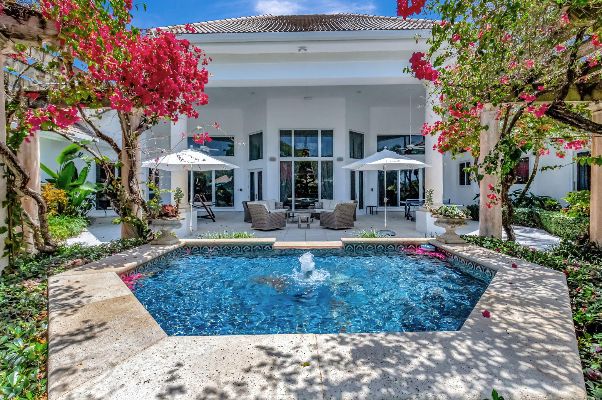 2599 Northwest 63rd Lane Boca Raton, FL 33496 - Photo 53 of 81 a view of a house with fountain in front of it