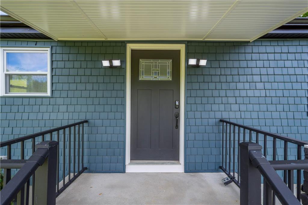 933 Boyce Road Bridgeville, PA 15017 - Photo 6 of 36 a front view of a house with a glass door