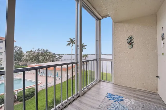 a view of a balcony with wooden floor