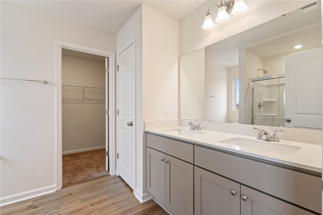 144 Cotesworth Street Pendleton, SC 29670 - Photo 6 of 9 This bathroom features a double vanity and sleek fixtures, perfect for daily routines.