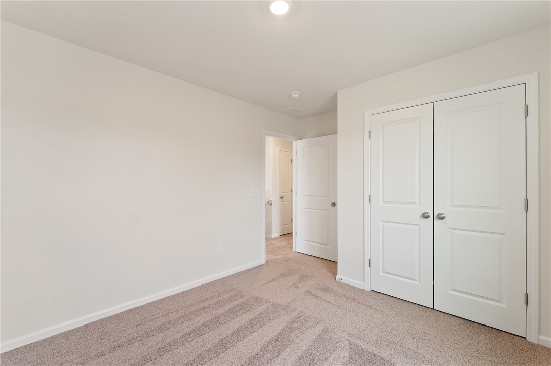 144 Cotesworth Street Pendleton, SC 29670 - Photo 7 of 9 This inviting bedroom features soft carpet and ample closet space, ready for your personal touch.