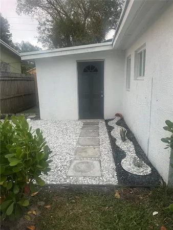 a view of a backyard of the house