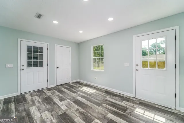 a kitchen with a refrigerator a sink and a stove