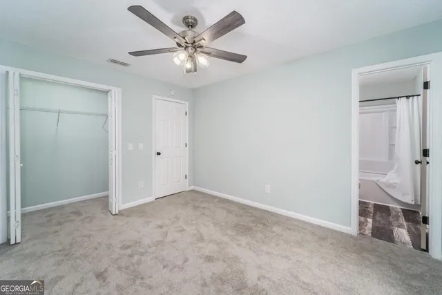 a bathroom with a sink toilet a mirror and shower
