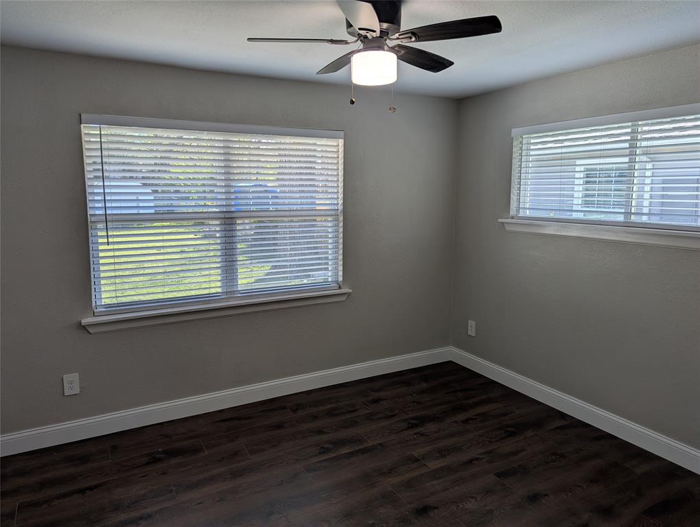 100 West Hull Street Denison, TX 75021 - Photo 15 of 28 a view of an empty room with wooden floor and a window