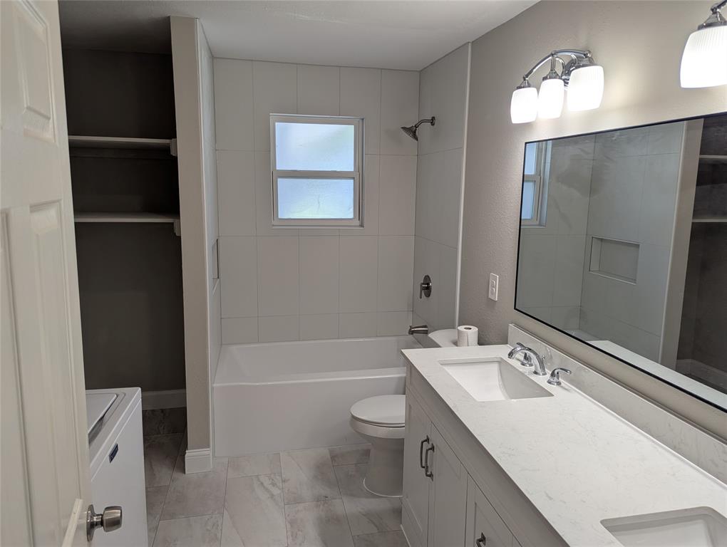 100 West Hull Street Denison, TX 75021 - Photo 18 of 28 a bathroom with a sink a toilet and shower