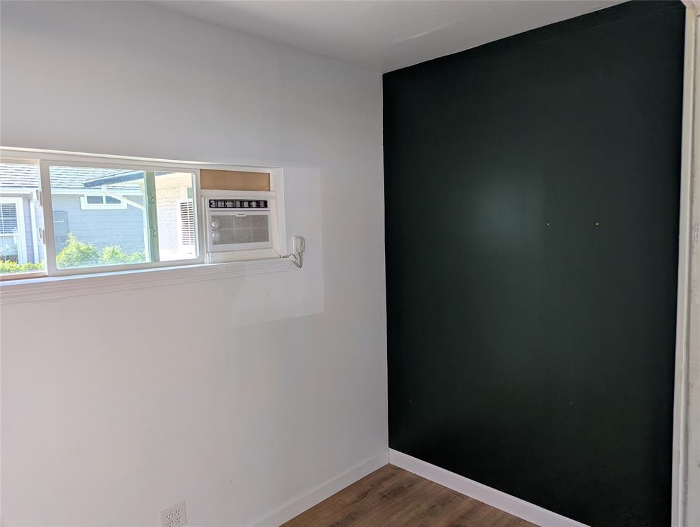 100 West Hull Street Denison, TX 75021 - Photo 22 of 28 a view of a small space with wooden floor and a window
