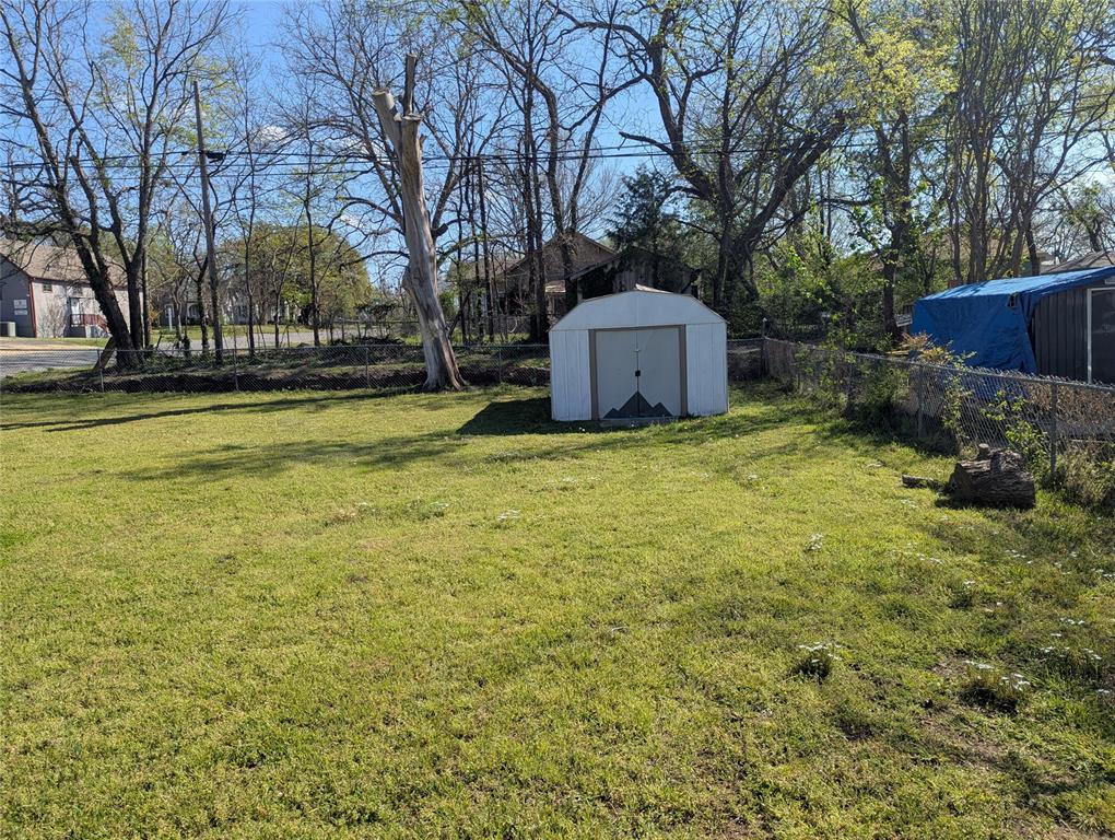 100 West Hull Street Denison, TX 75021 - Photo 25 of 28 a view of a house with a yard