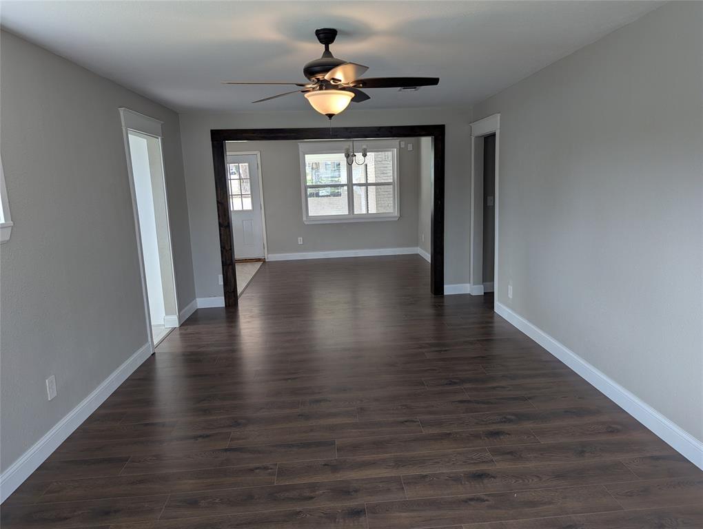 100 West Hull Street Denison, TX 75021 - Photo 7 of 28 a view of an empty room with wooden floor and a window