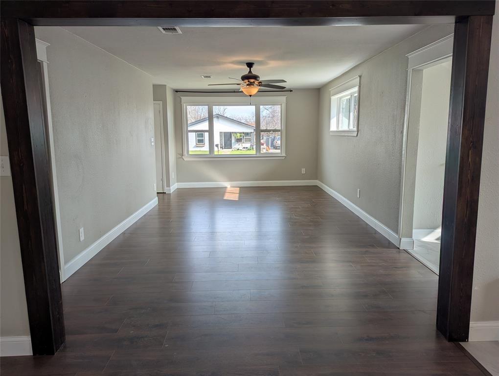 100 West Hull Street Denison, TX 75021 - Photo 8 of 28 an empty room that has a window