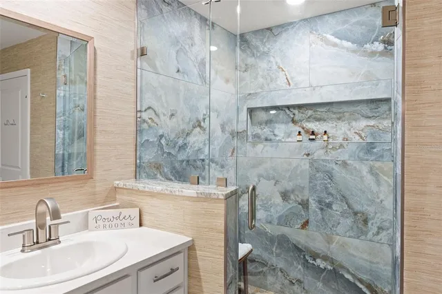 a bathroom with a bathtub shower sink and toilet
