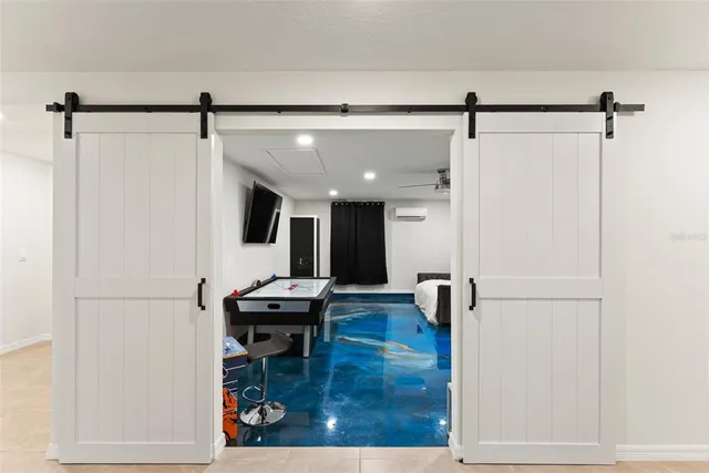 a large bed in a white room