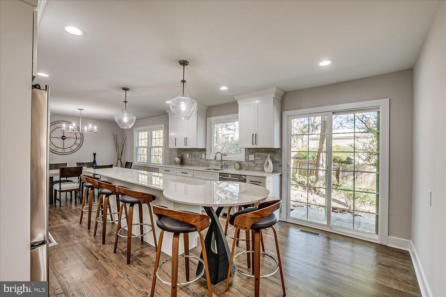 57 Mt Lucas Road Princeton, NJ 08540 - Photo 20 of 41 a kitchen with stainless steel appliances granite countertop table chairs stove and wooden floor