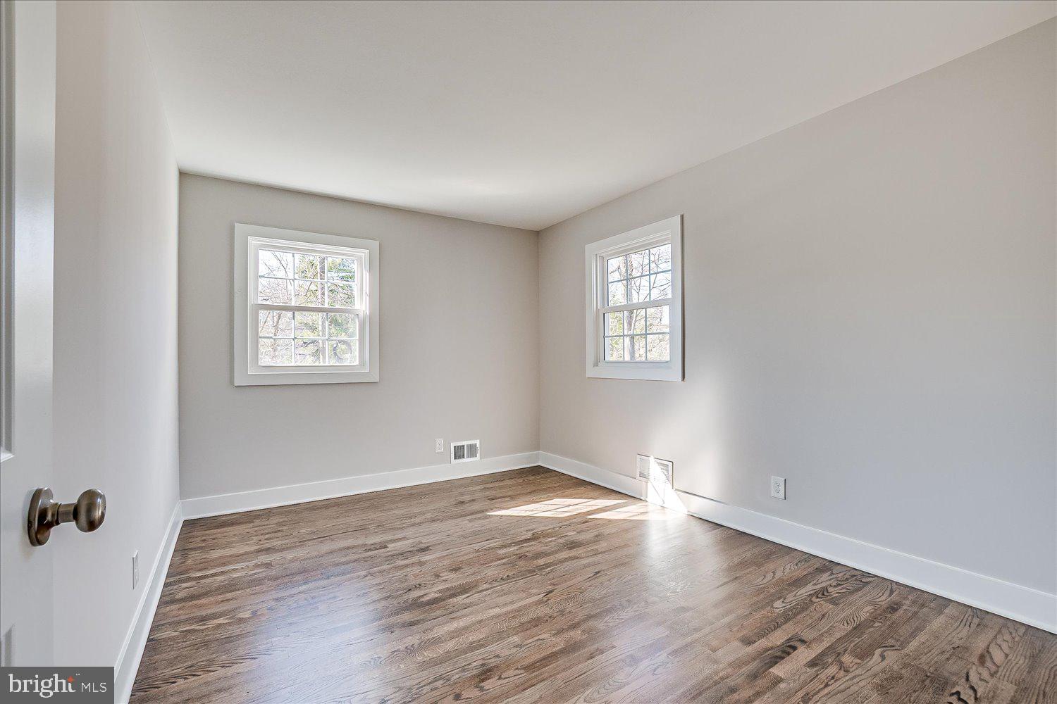 57 Mt Lucas Road Princeton, NJ 08540 - Photo 34 of 41 an empty room with wooden floor and windows