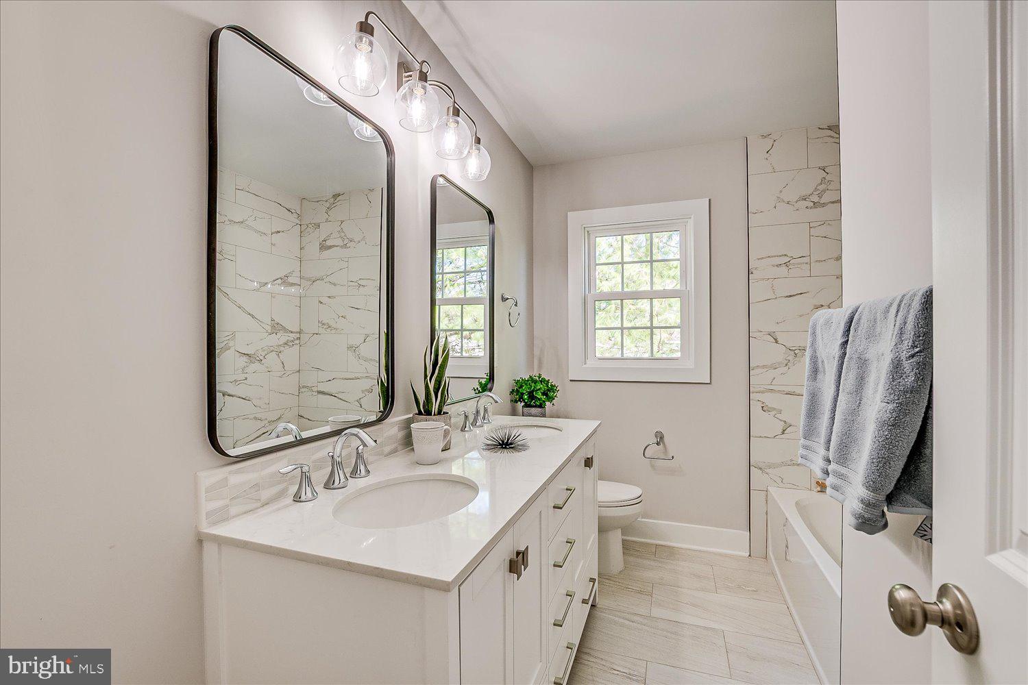 57 Mt Lucas Road Princeton, NJ 08540 - Photo 36 of 41 a bathroom with double vanity sink a mirror and a shower