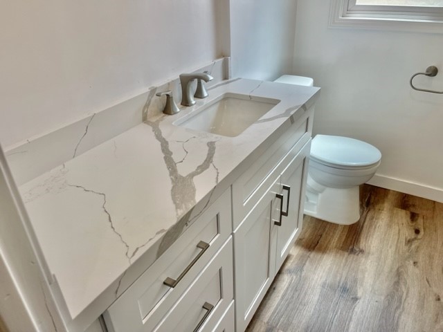 19550 Vanowen Street Reseda, CA 91335 - Photo 6 of 10 a bathroom with a sink and a toilet
