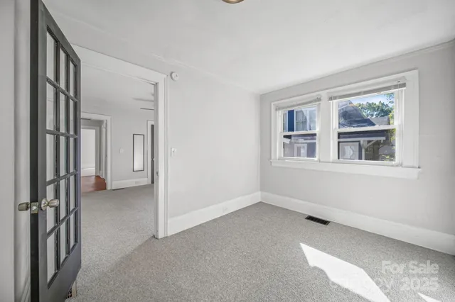 a view of an empty room with a window