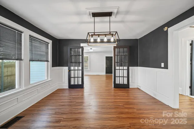 a view of a livingroom with wooden floor