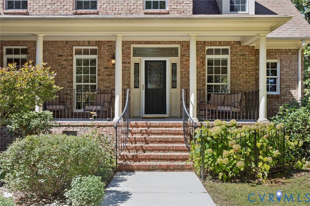 720 Arlington Island Road Lanexa, VA 23089 - Photo 13 of 50 View of exterior entry featuring a porch and roof