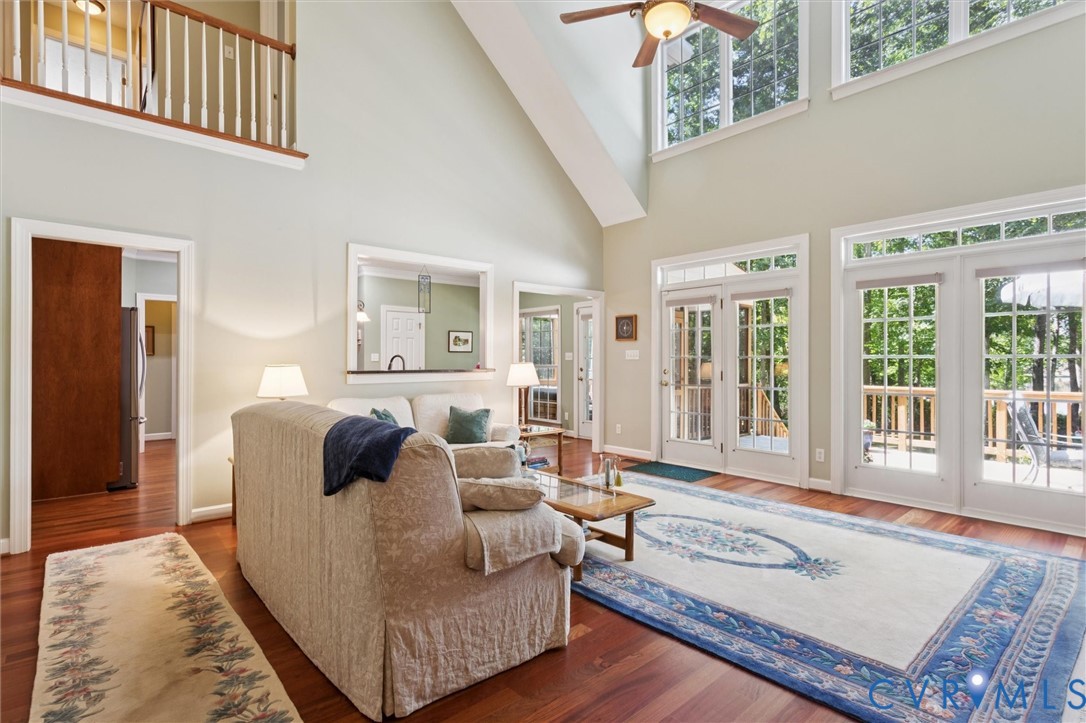 720 Arlington Island Road Lanexa, VA 23089 - Photo 17 of 50 Living area featuring a high ceiling, healthy amou