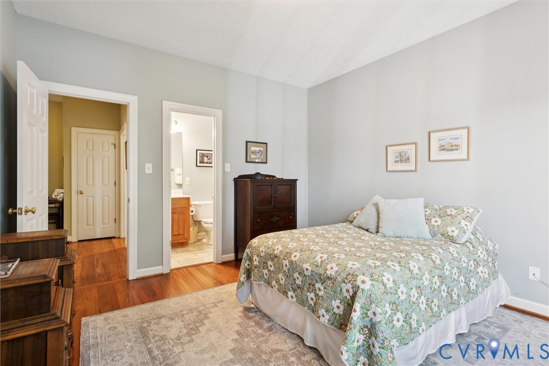 720 Arlington Island Road Lanexa, VA 23089 - Photo 28 of 50 Bedroom with wood finished floors and ensuite bath