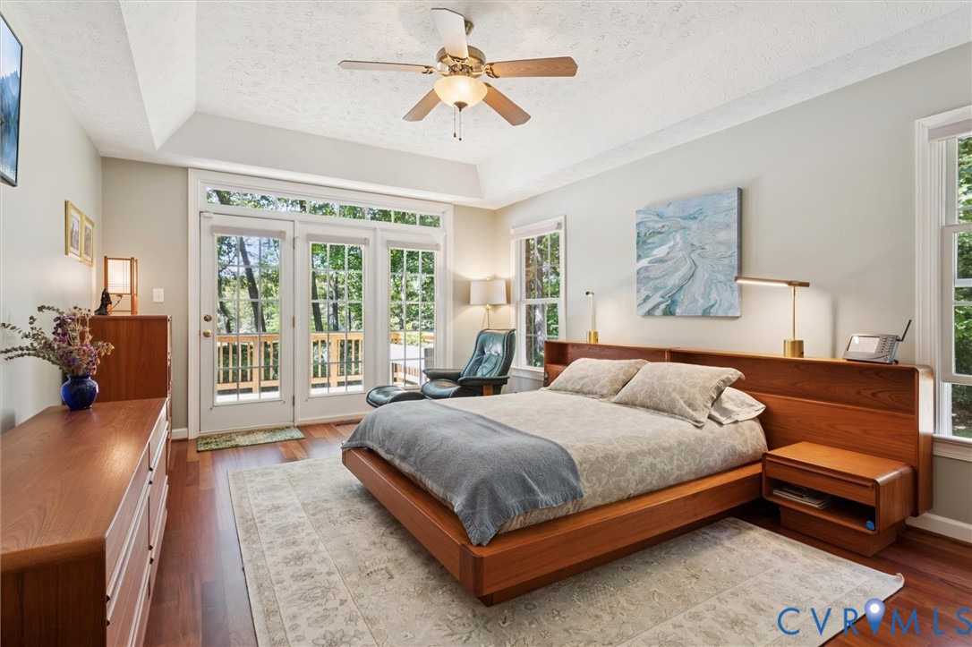 720 Arlington Island Road Lanexa, VA 23089 - Photo 29 of 50 Bedroom with a raised ceiling, access to outside,