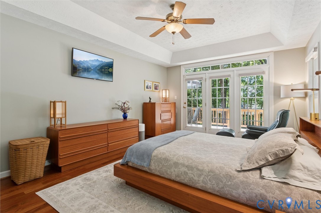 720 Arlington Island Road Lanexa, VA 23089 - Photo 30 of 50 Bedroom with a raised ceiling, access to outside,