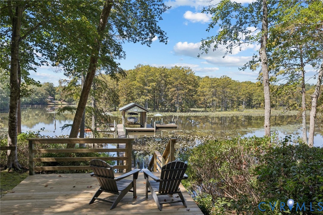 720 Arlington Island Road Lanexa, VA 23089 - Photo 46 of 50 Deck featuring a water view and a boat dock