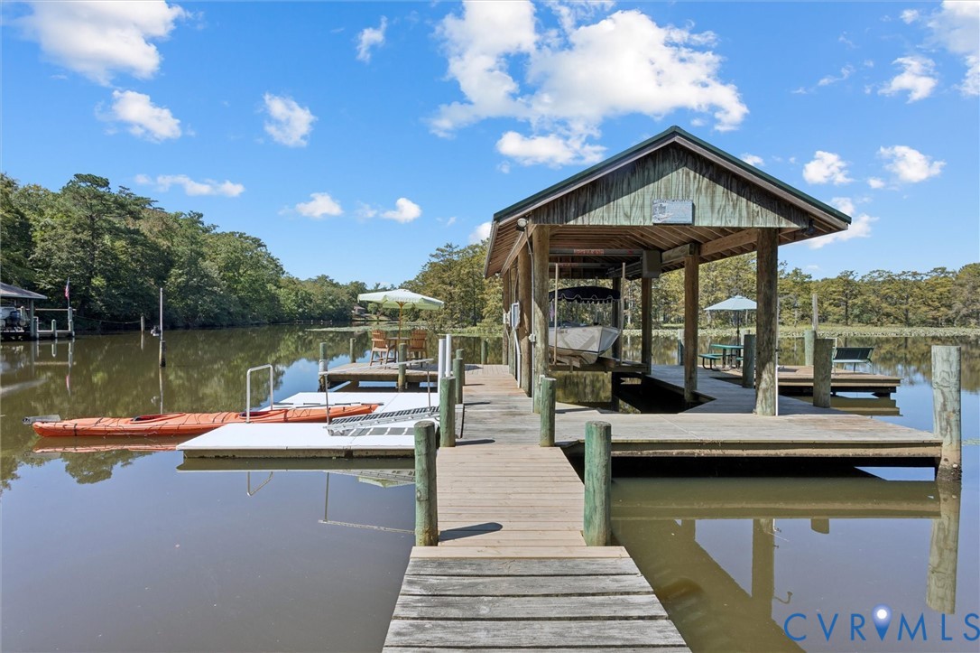 720 Arlington Island Road Lanexa, VA 23089 - Photo 47 of 50 Dock area with a water view and view of scattered