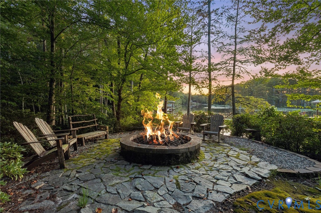 720 Arlington Island Road Lanexa, VA 23089 - Photo 9 of 50 Patio terrace at dusk with a patio area and a fire