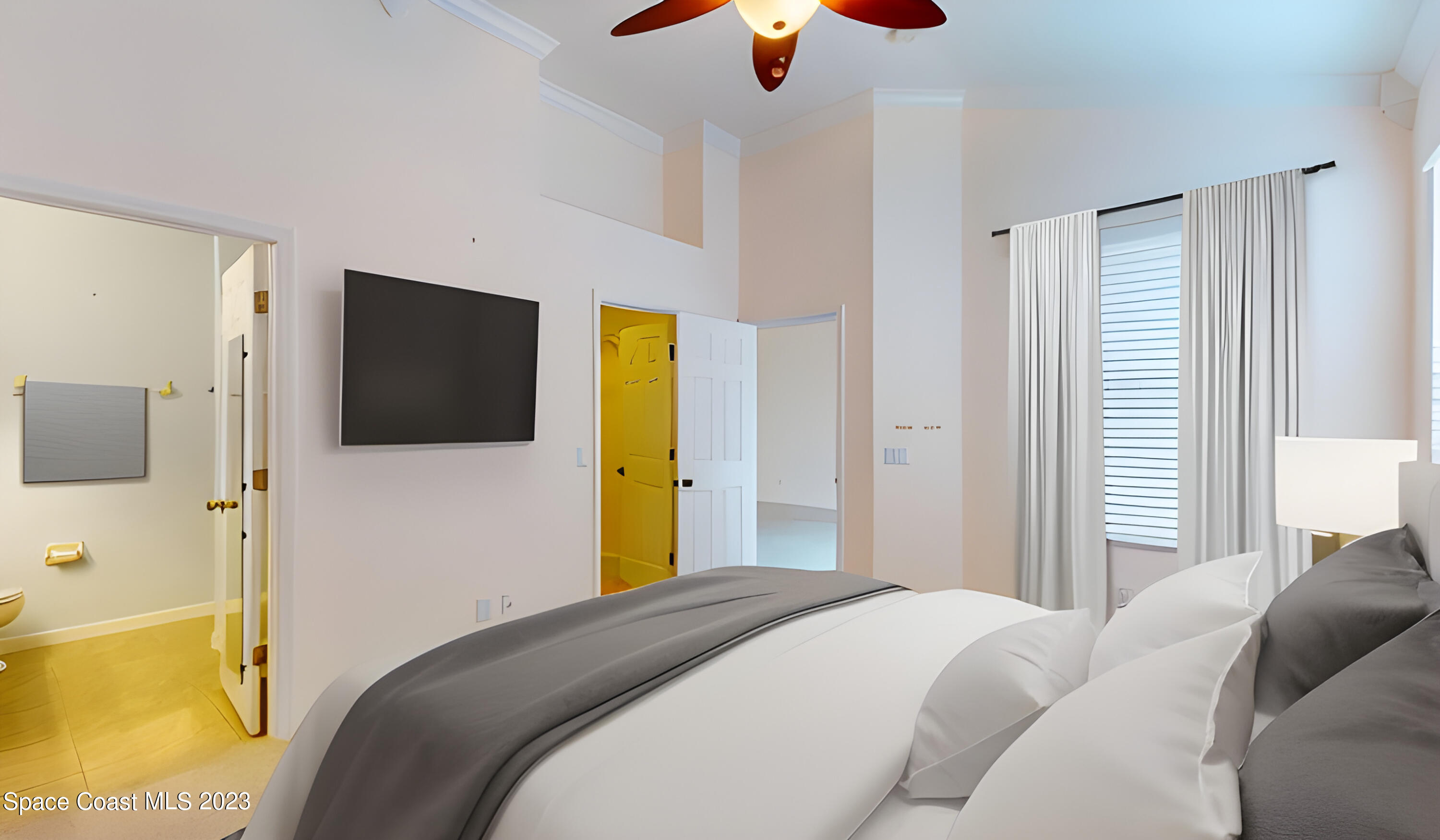 3151 Arden Circle Melbourne, FL 32934 - Photo 21 of 32 a bedroom with a bed and flat screen tv
