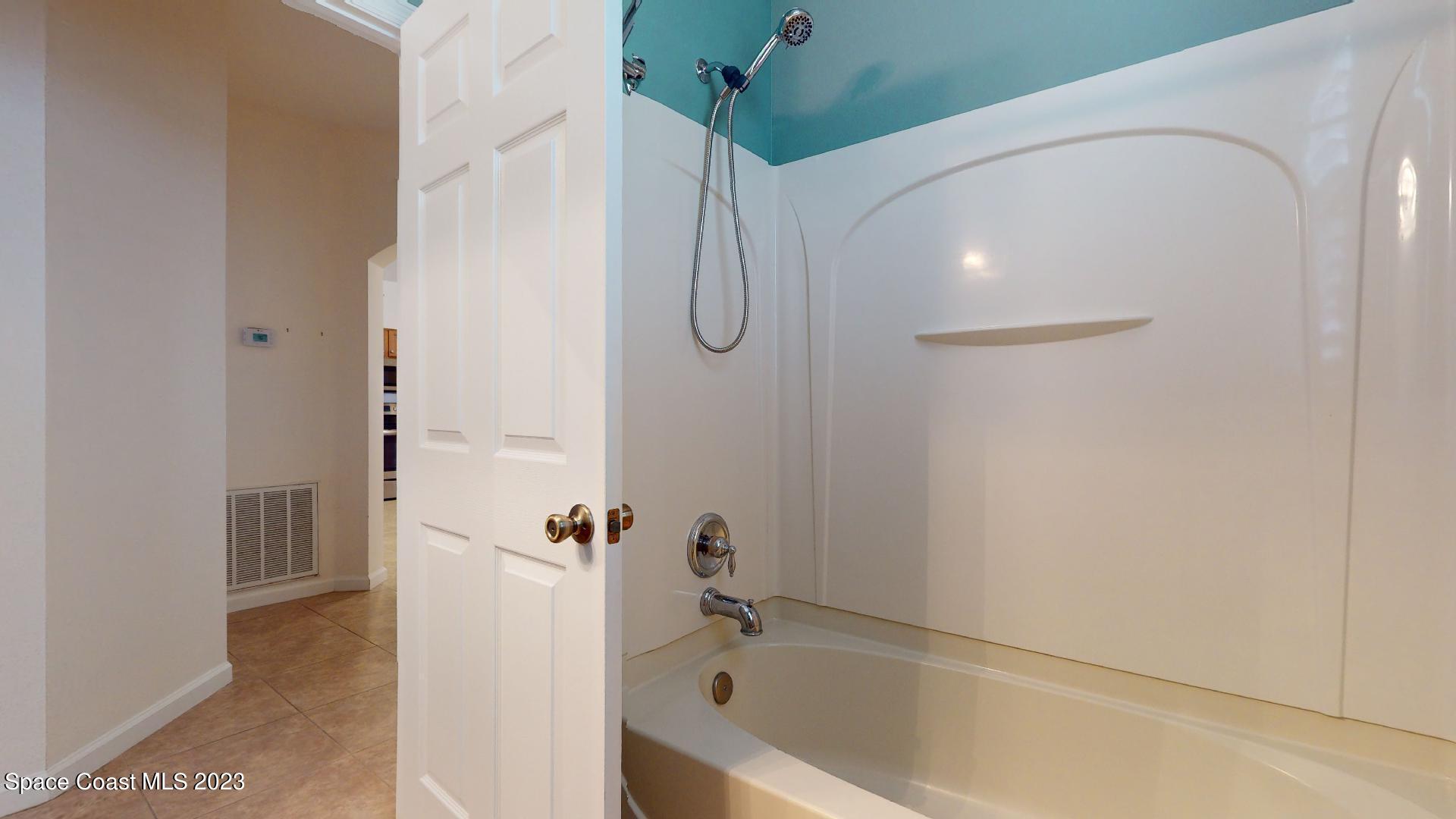 3151 Arden Circle Melbourne, FL 32934 - Photo 27 of 32 a bathroom with a bathtub