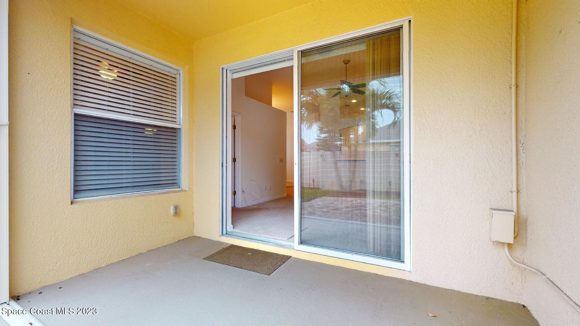 3151 Arden Circle Melbourne, FL 32934 - Photo 28 of 32 a bathroom with a glass shower door