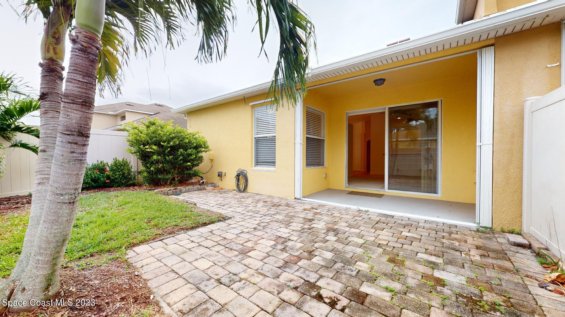 3151 Arden Circle Melbourne, FL 32934 - Photo 29 of 32 a front view of a house having yard