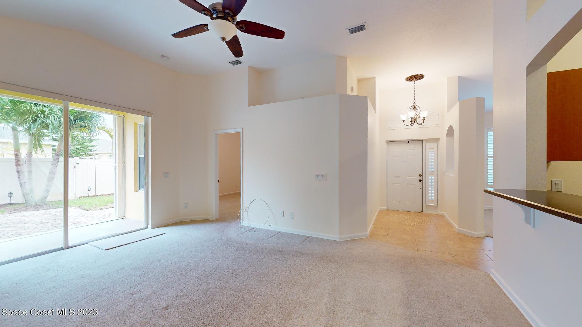 3151 Arden Circle Melbourne, FL 32934 - Photo 7 of 32 a view of a room with a ceiling fan and window
