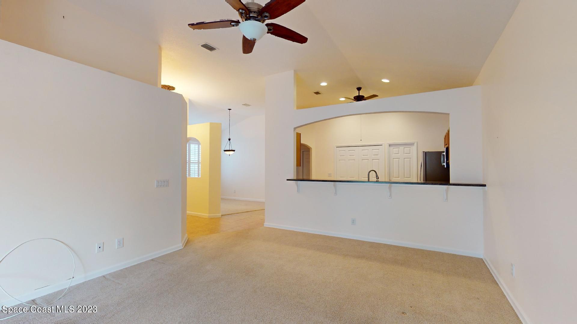 3151 Arden Circle Melbourne, FL 32934 - Photo 10 of 32 a view of a room with a ceiling fan