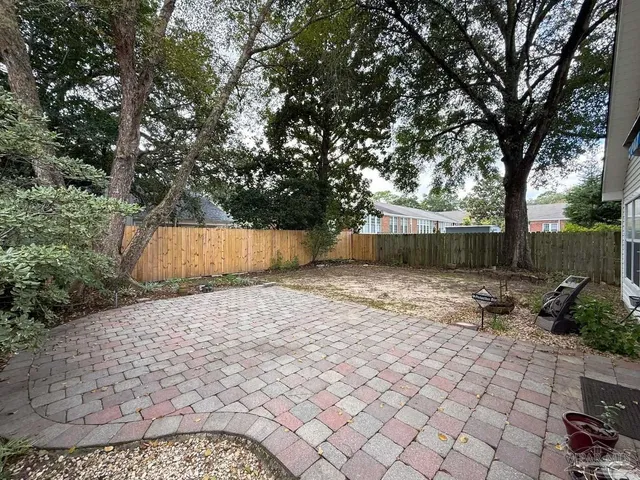 a backyard of a house with lots of green space