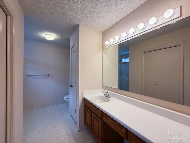 a bathroom with a sink double vanity and a mirror