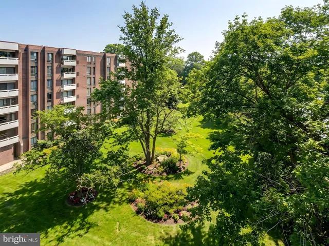a kitchen with white cabinets sink appliances and cabinets