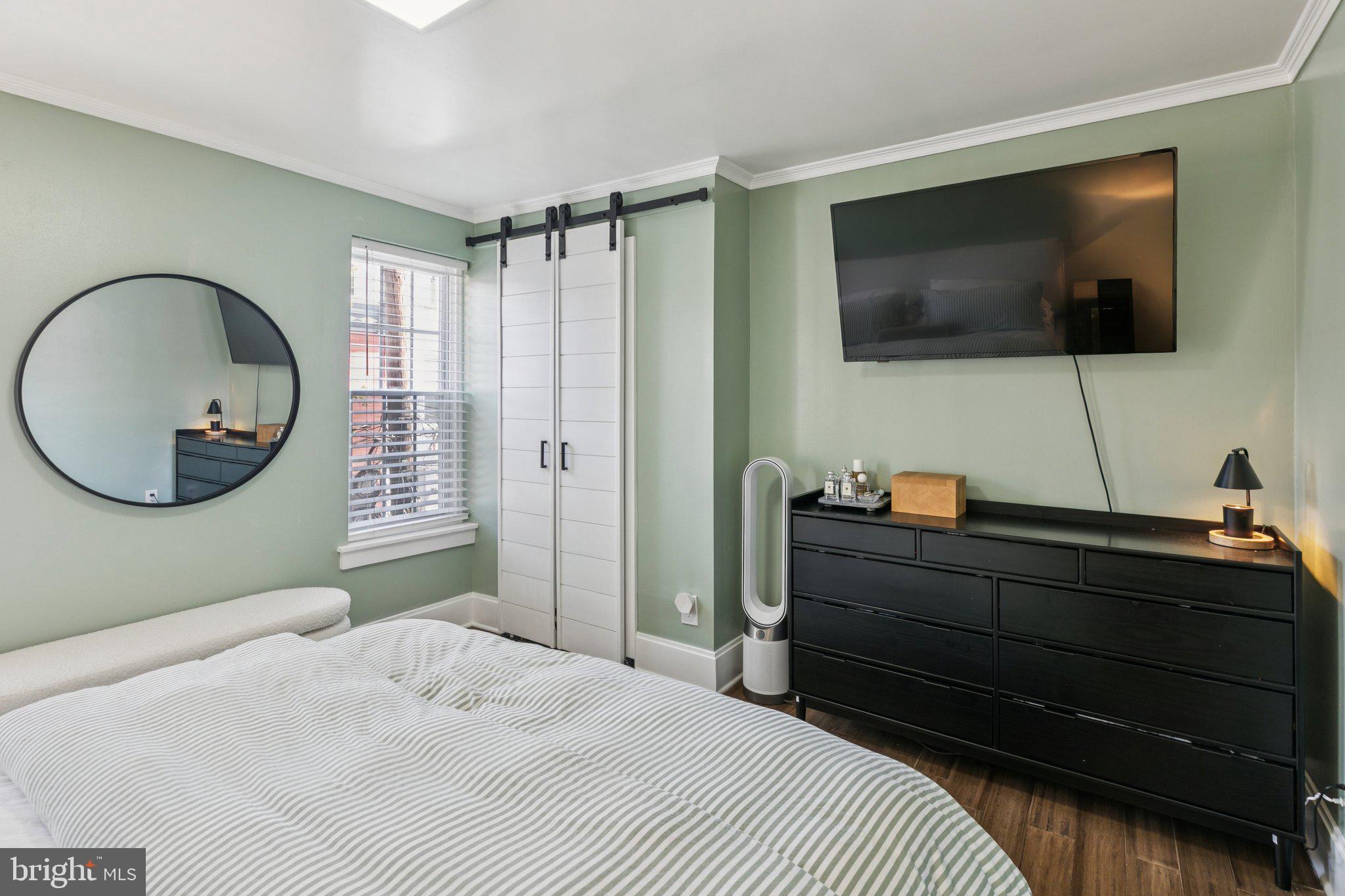 2412 Madison Square Philadelphia, PA 19146 - Photo 21 of 39 a bedroom with a bed and a flat screen tv