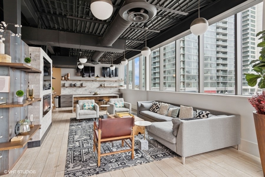 660 West Wayman Street, Unit 501 Chicago, IL 60661 - Photo 20 of 24 a roof deck with couch and chairs