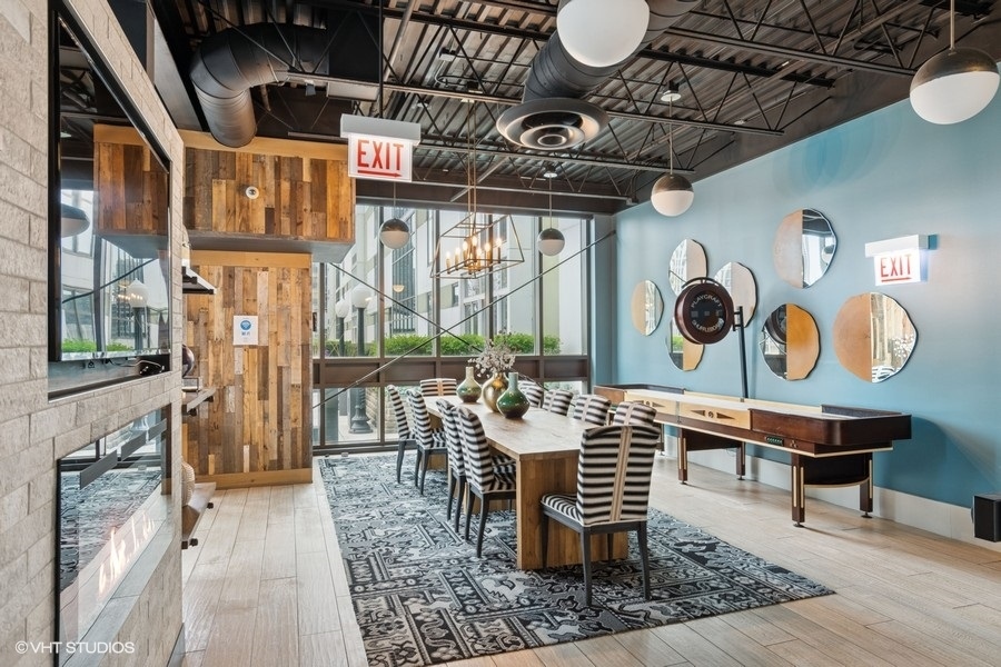 660 West Wayman Street, Unit 501 Chicago, IL 60661 - Photo 21 of 24 a dining room with furniture and wooden floor