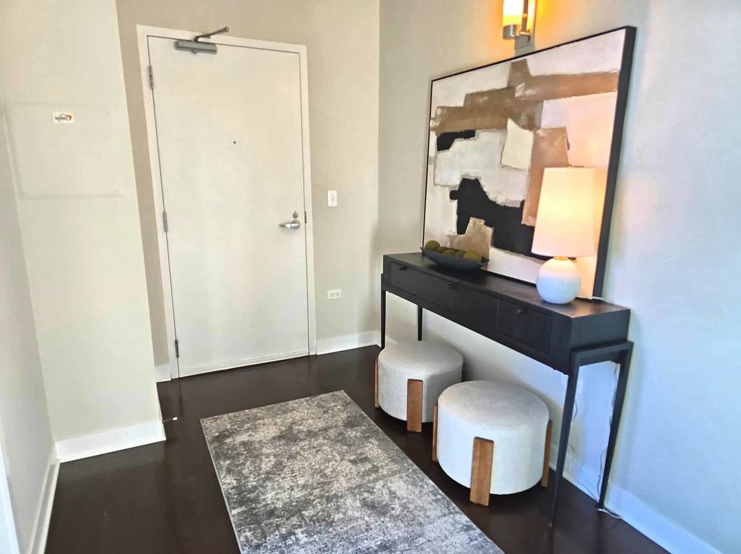 660 West Wayman Street, Unit 501 Chicago, IL 60661 - Photo 3 of 24 a view of hallway with furniture and wooden floor